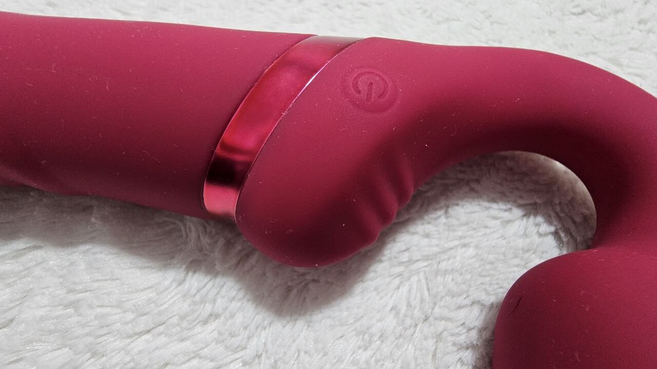 pink double dildo, vibrating strap on, close up of lovense lapis button and ribbing