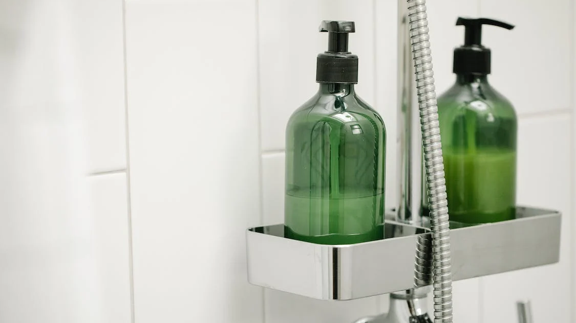 green pump bottles in shower