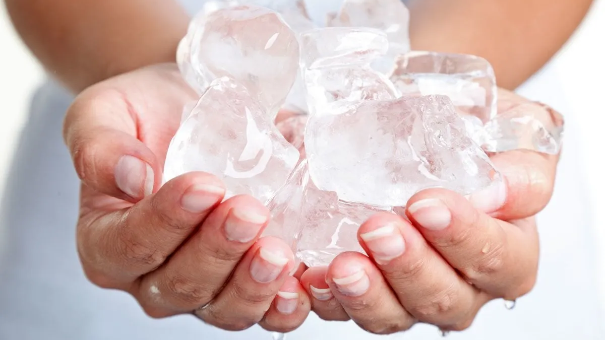 close up of woman holding ice cubes, How to overcome a sexual rut, temperature play