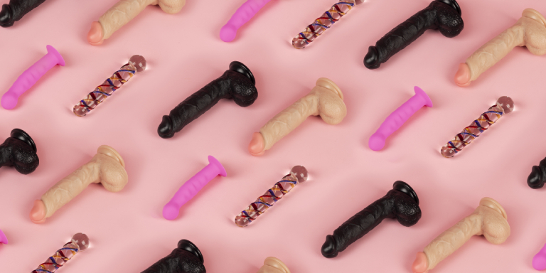 dildos on pink background, how to use a dildo guide 