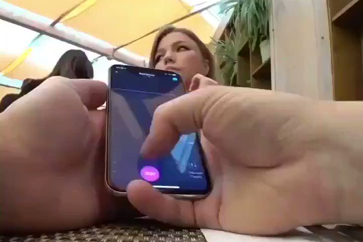 man using Lovense remote app to control a handsfree sex toy